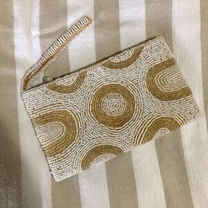 Handmade white and cream beaded wristlet.